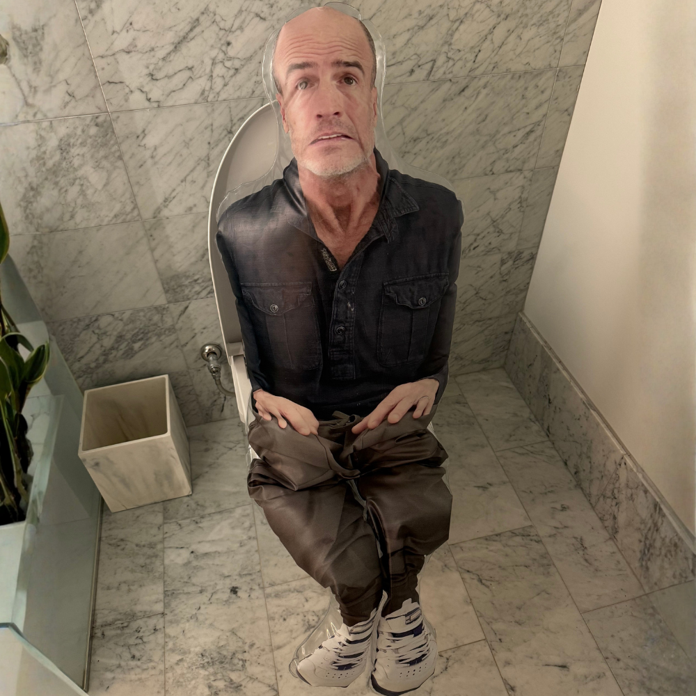 Inflatable Squatting Andy sitting in bathroom stall prank