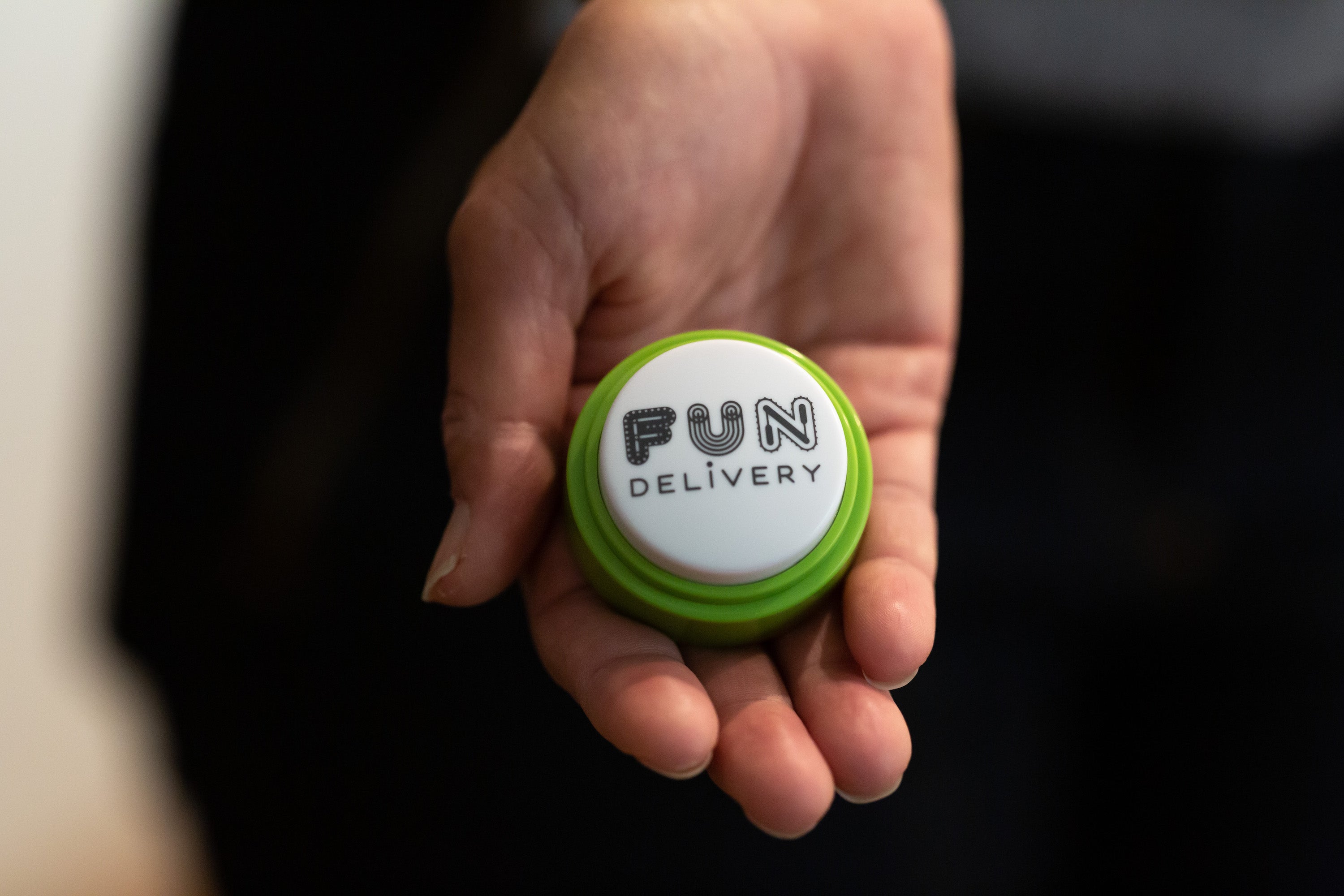 Man Akin talking button sound device close up