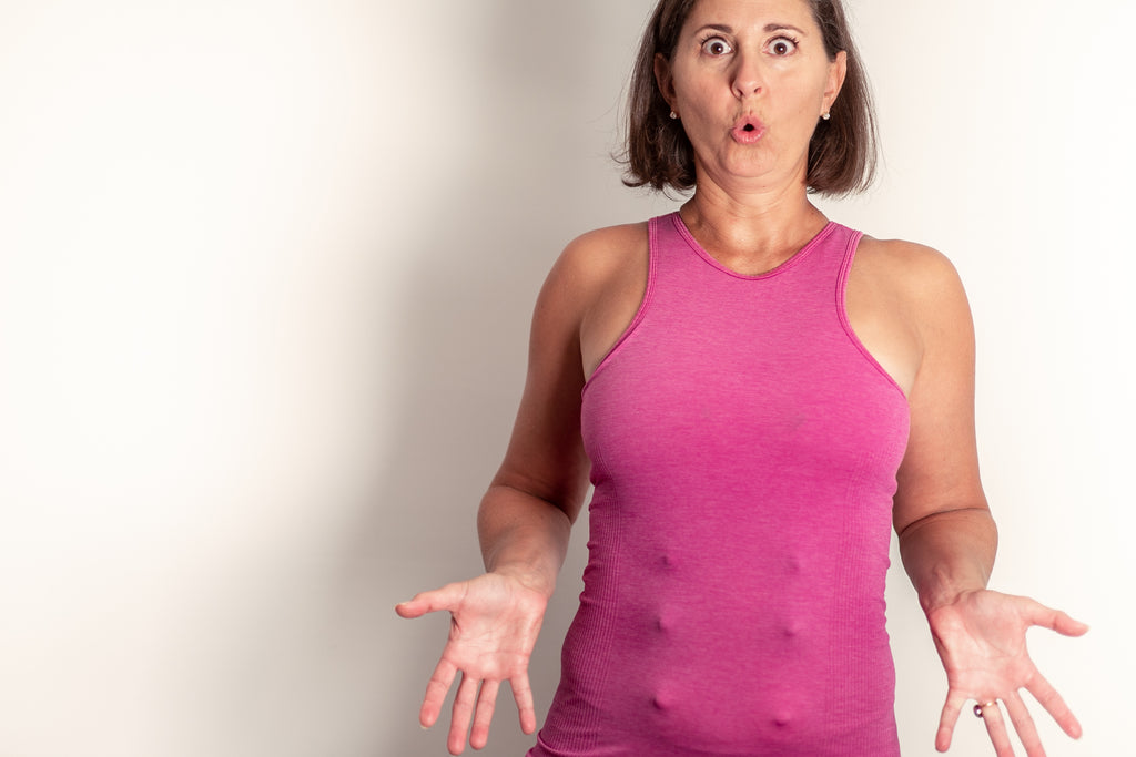 Multiple Party Hats silicone nipple accessories under a pink tank