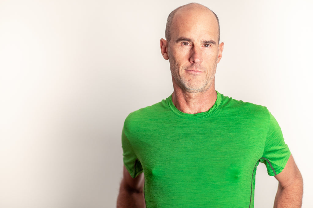 Man wearing Party Hats silicone nipple accessory under green shirt