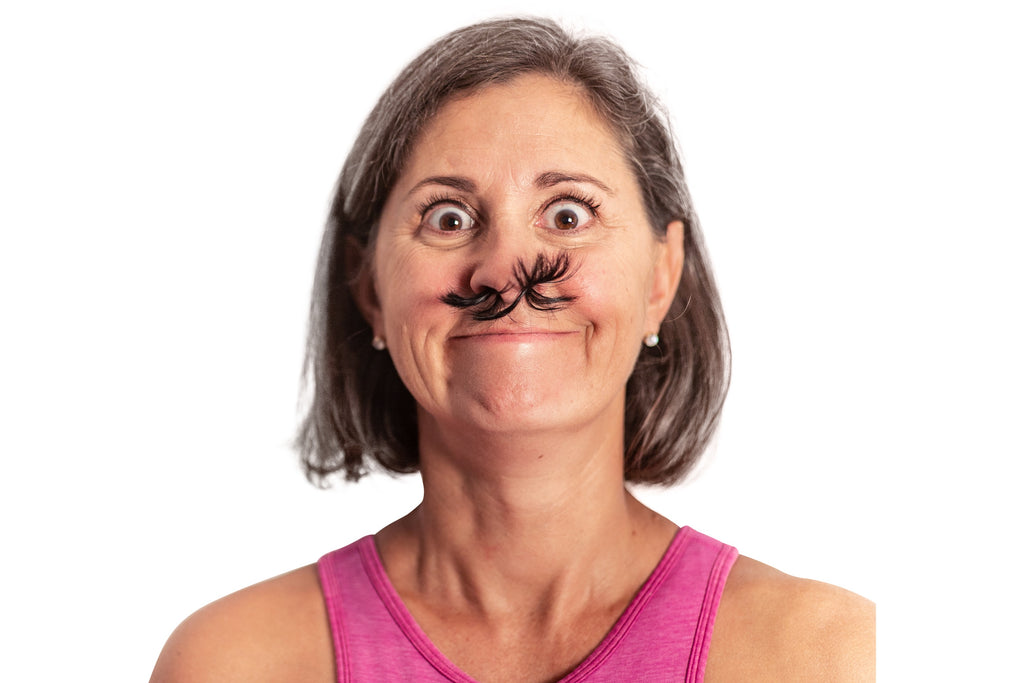 Woman wearing fake nose hair front view