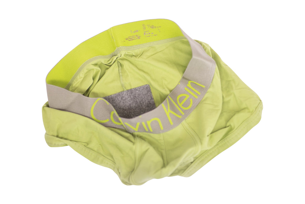 Subtle Butt disposable pad attached to green boxers