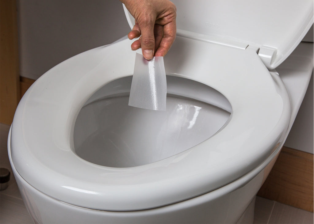 Subtle Bowl dissolvable sheet placed in toilet bowl